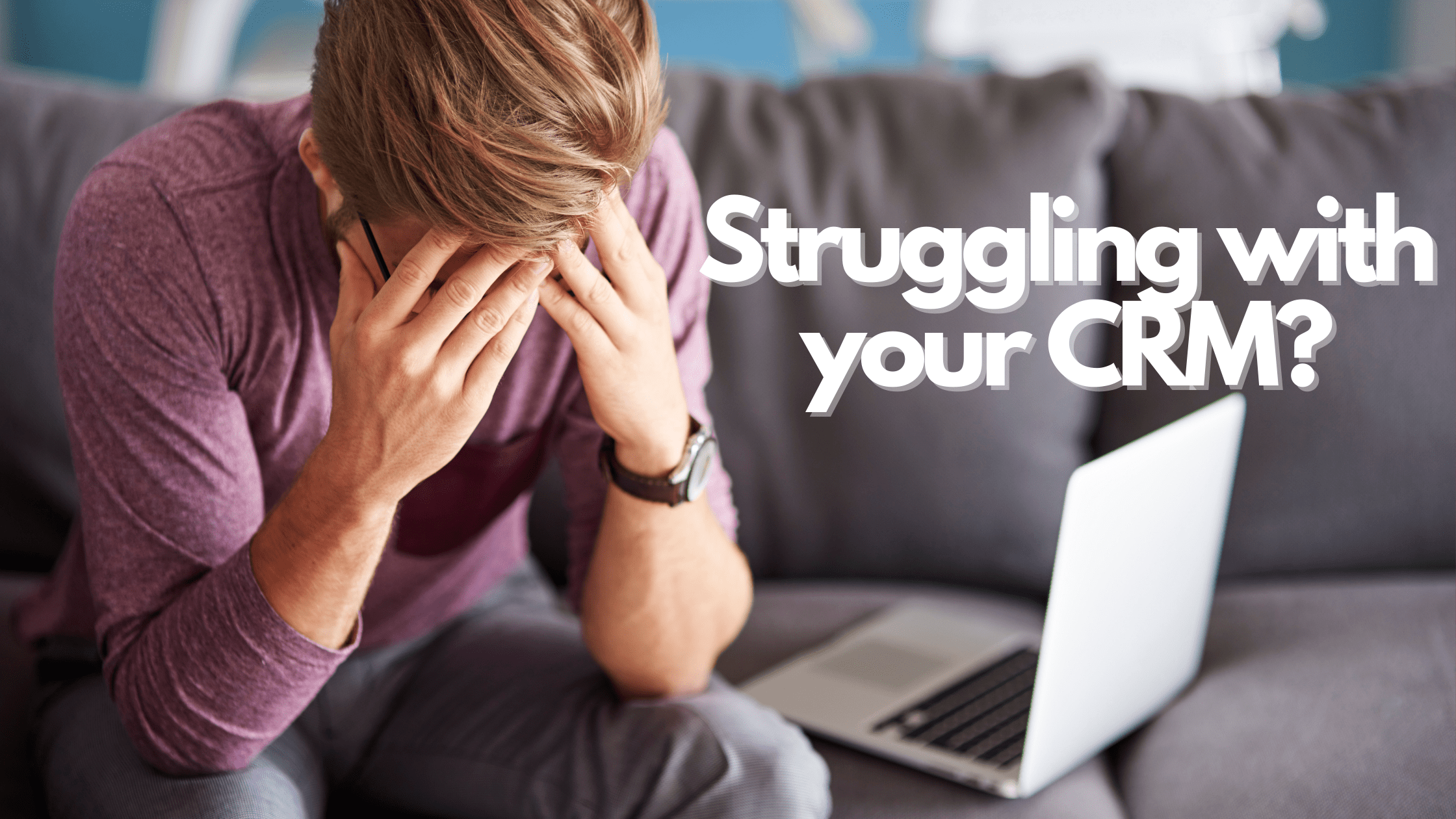 man slouched, worried sitting in a couch